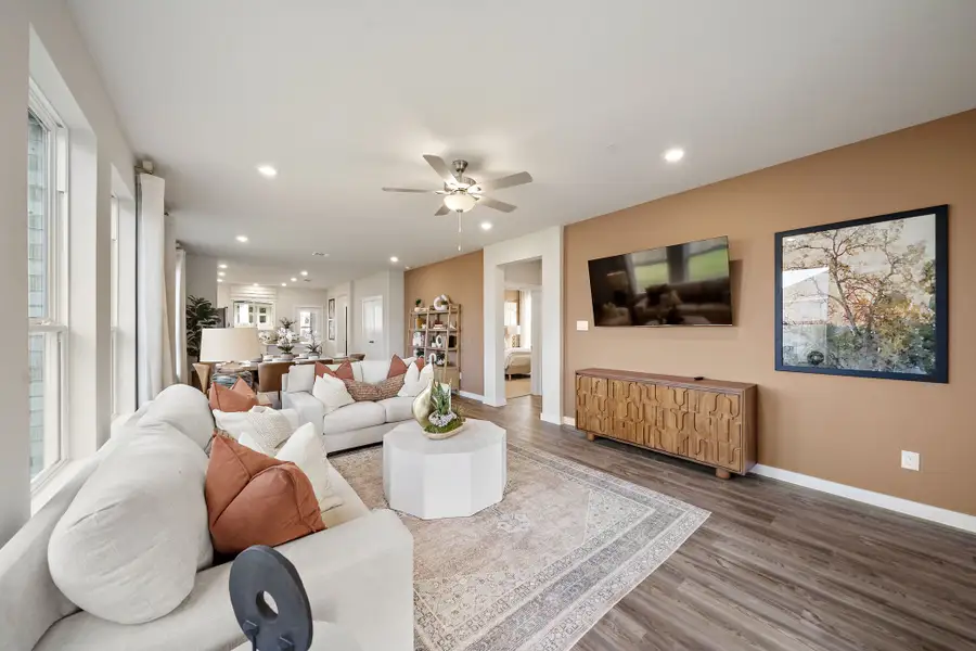 A living room with a couch and a table.