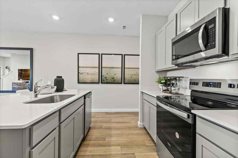 A kitchen with white cabinets. A kitchen with white cabinets.