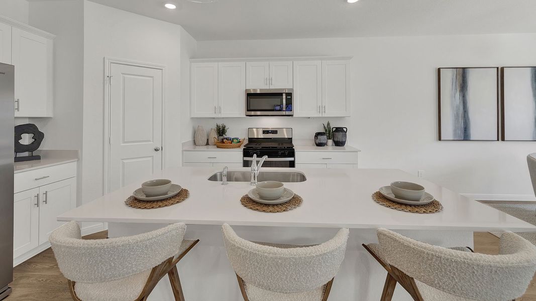 Furnished interior in a model home at Paramount in Kyle (Image 14).