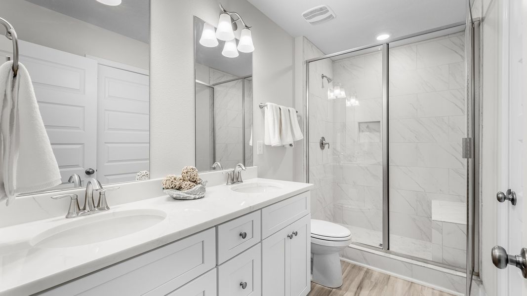 Furnished interior in a model home at WindMark Townhomes in Port Saint Joe (Image 22).