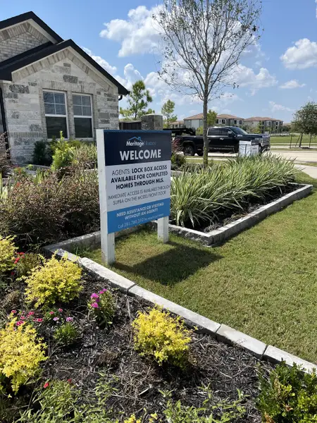 A beautiful home with lush landscaping in Southwinds by Meritage Homes, Baytown, TX.