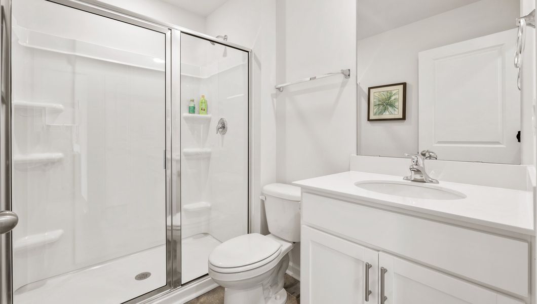 Furnished interior in a model home at Paddock Point in Roebuck (Image 12).