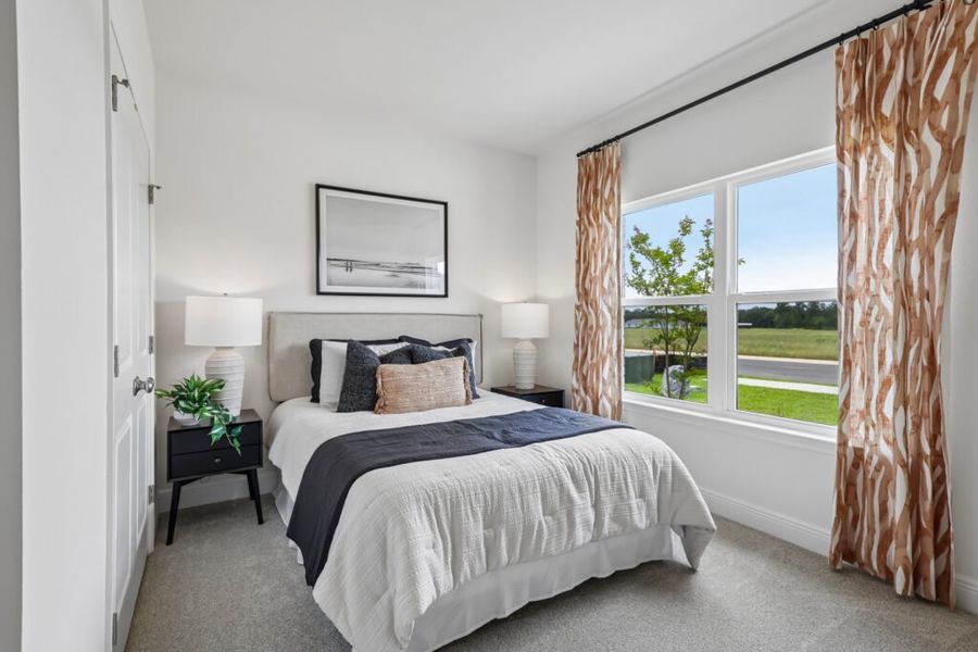 Furnished interior in a model home at Mahogany At Jubilee in Pace (Image 34).