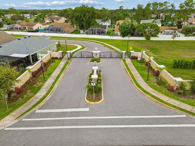 Entrance to the Highland Hills community in Hudson, FL, featuring signage and landscaping (Image 12).
