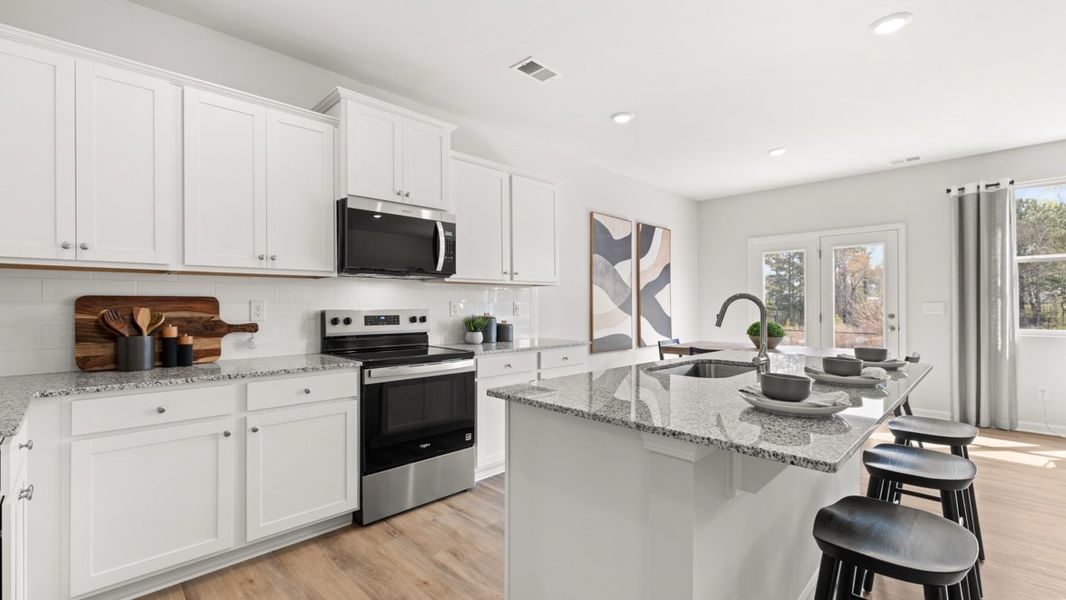 Furnished interior in a model home at Carlton in Douglasville (Image 20).