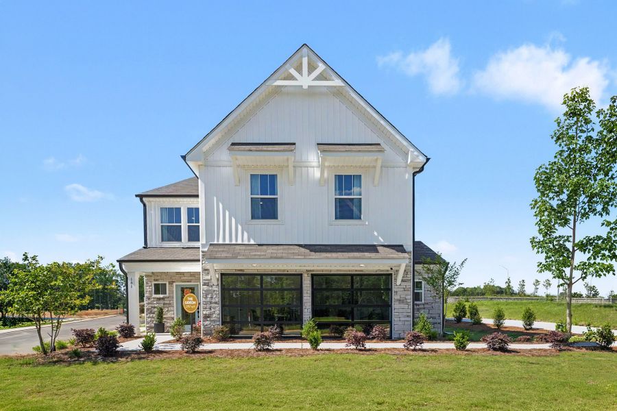 Front exterior of a home in the White Oak Creek Crossing community, located in Angier, NC (Image 1). Front exterior of a home in the White Oak Creek Crossing community, located in Angier, NC (Image 1).