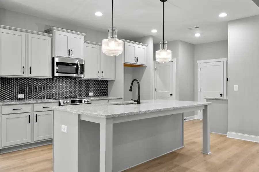 Furnished interior in a model home at Deer Creek in Moreland (Image 6).