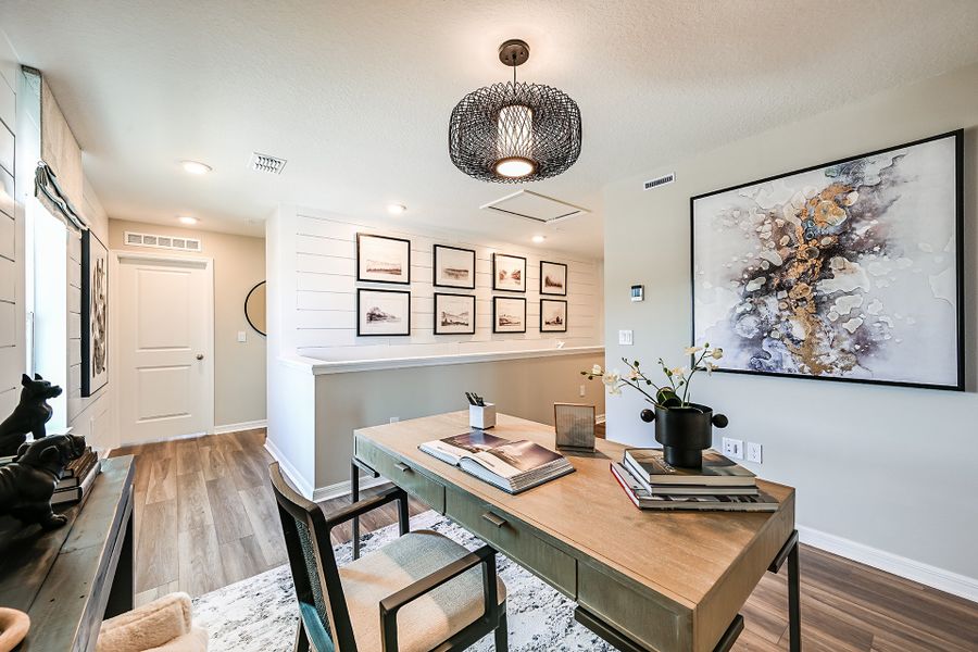 Furnished interior in a model home at Towns at Riverwalk: Lake Monroe TH in Sanford (Image 6).