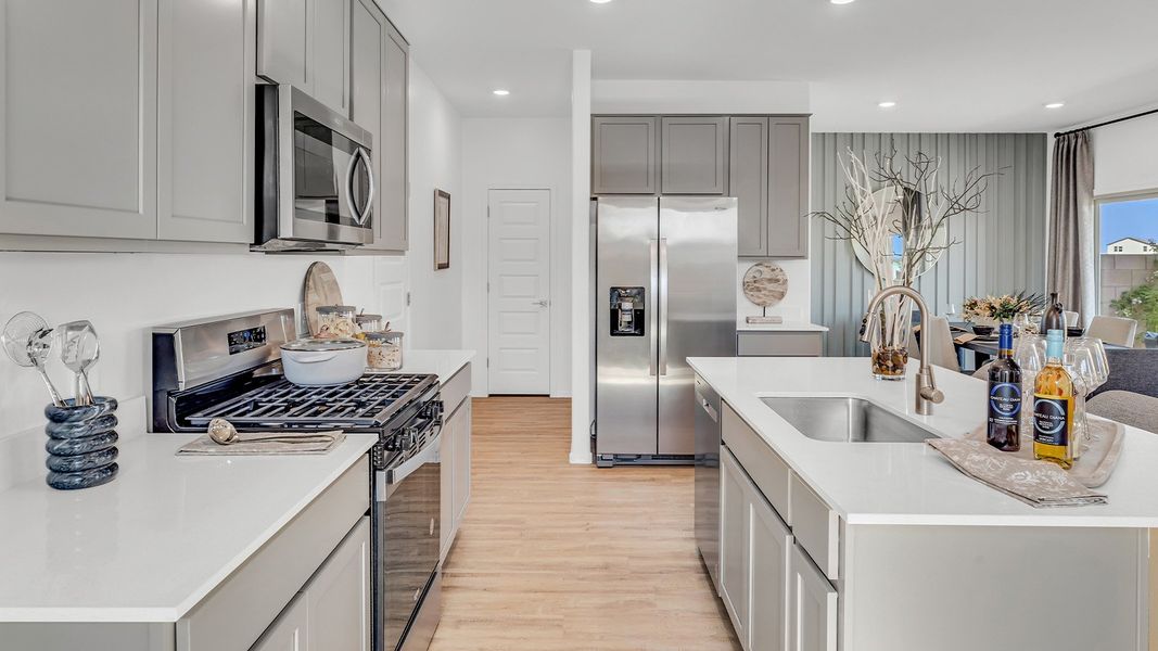 Furnished interior in a model home at Coronet at Gladden Farms in Marana (Image 11).