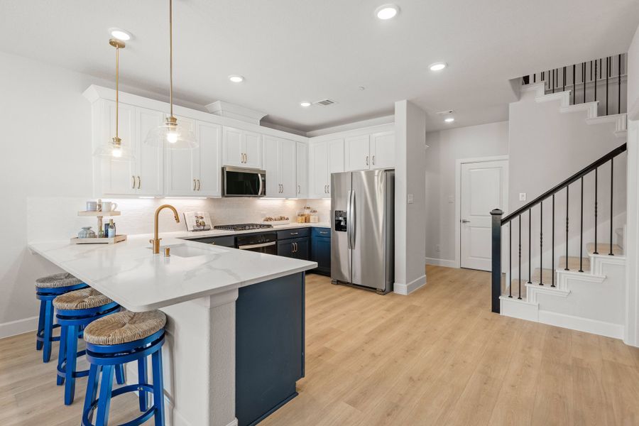 Furnished interior in a model home at Waterbend: Ivy Townhomes in Euless (Image 12).