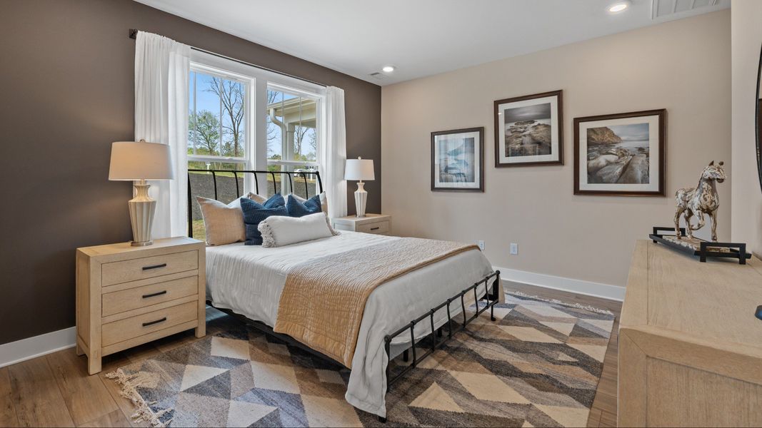 Spacious and serene primary suite with thoughtful design in a desirable DRB Homes community