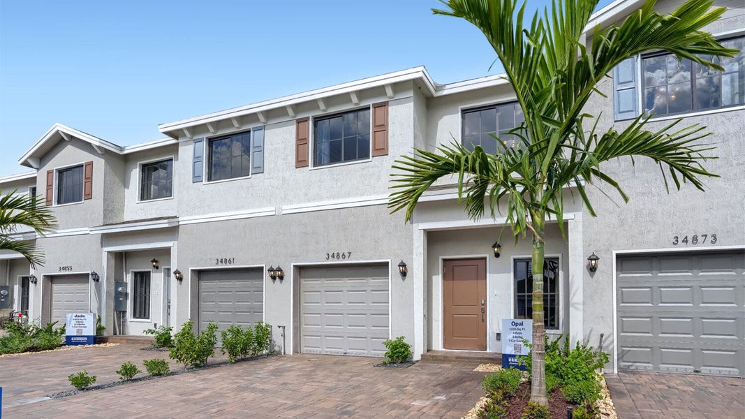 Front exterior of a home in the Juniper Cove community, located in Homestead, FL (Image 9).