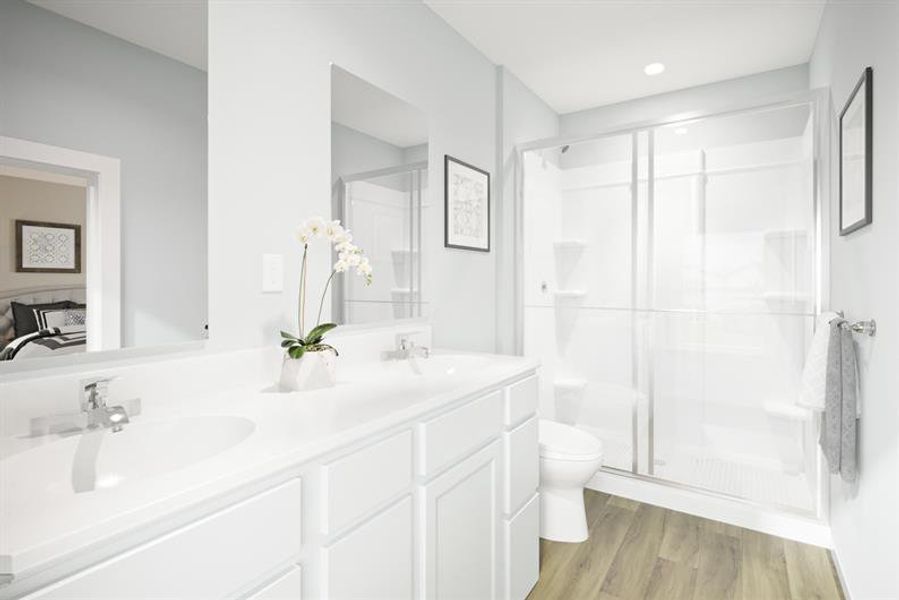 Enjoy the space you deserve with dual vanity sinks and plenty of counter space in your owner's bath.