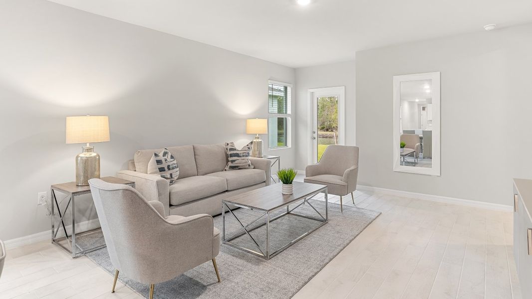 Furnished interior in a model home at Coral Lakes - Tradition & Express in Punta Gorda (Image 36).