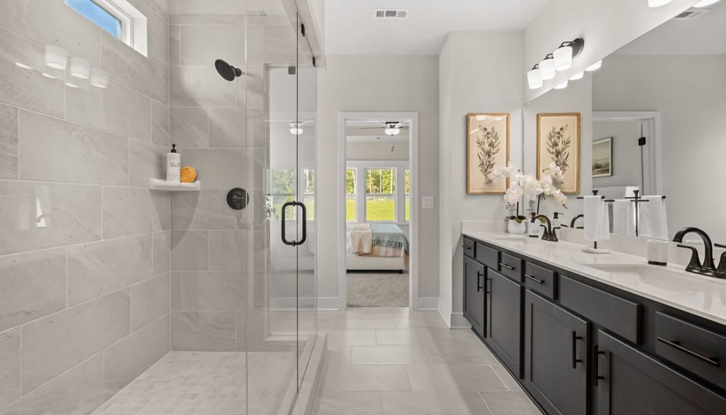 Furnished interior in a model home at Rosewood Lake Preserve in Hoschton (Image 29).