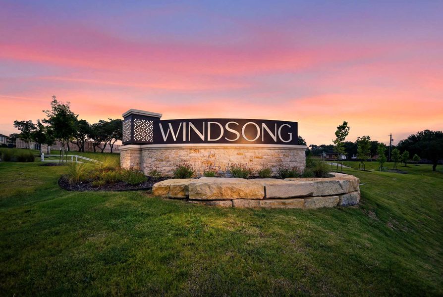 Entrance to the Windsong - Reserve Series community in Boerne, TX, featuring signage and landscaping (Image 2). Entrance to the Windsong - Reserve Series community in Boerne, TX, featuring signage and landscaping (Image 2).