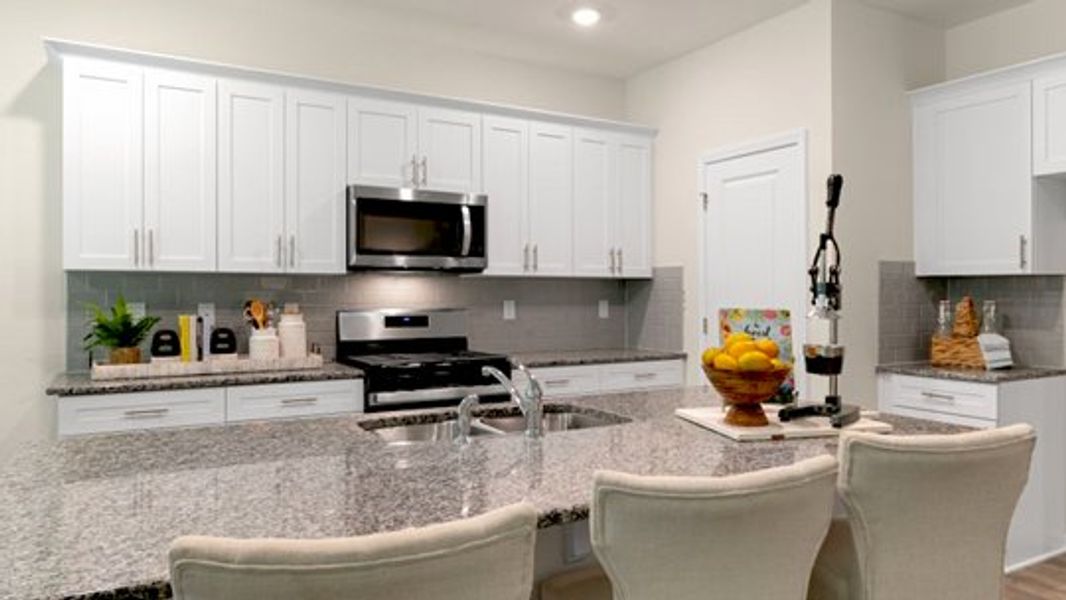 Furnished interior in a model home at River Stone in Elm City (Image 12).