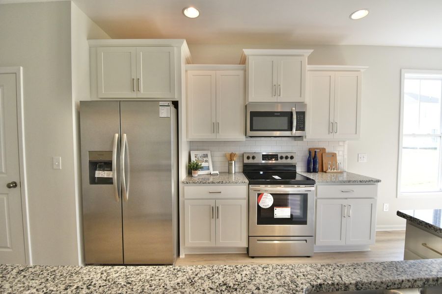 Furnished interior in a model home at Homesteads at Point Caswell in Columbia (Image 9).