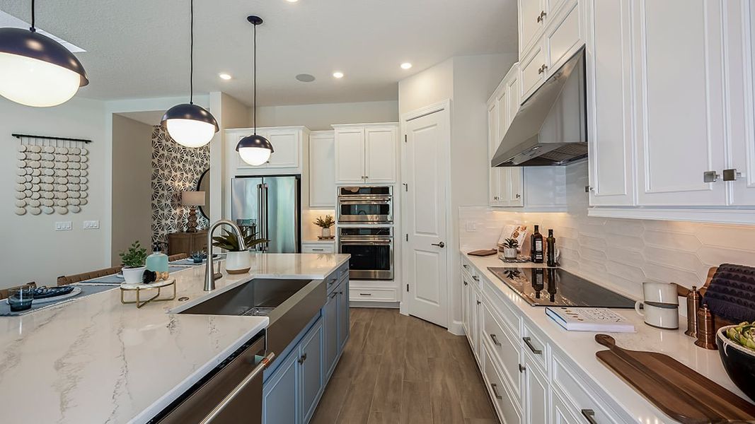 Furnished interior in a model home at Esplanade Lake Club in Fort Myers (Image 9). Furnished interior in a model home at Esplanade Lake Club in Fort Myers (Image 9).