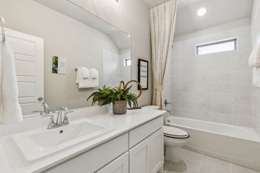 REPRESENTATIVE PHOTO – Bathroom in a Lakehaven Wimbledon model home in Farmersville TX by Trophy Signature Homes
