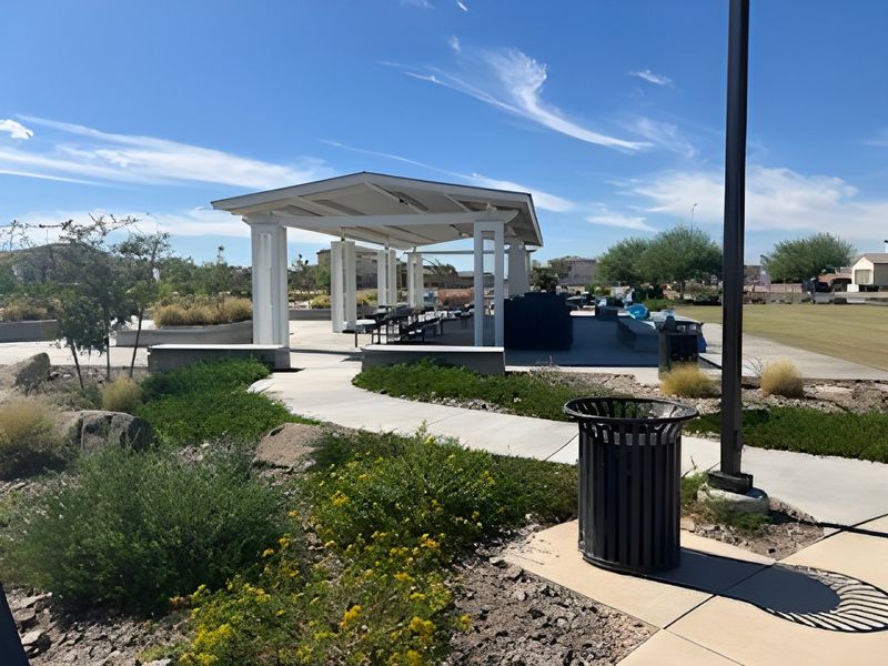 A modern pavilion surrounded by lush greenery in Alamar: Premier by Lennar, located in Avondale, AZ.