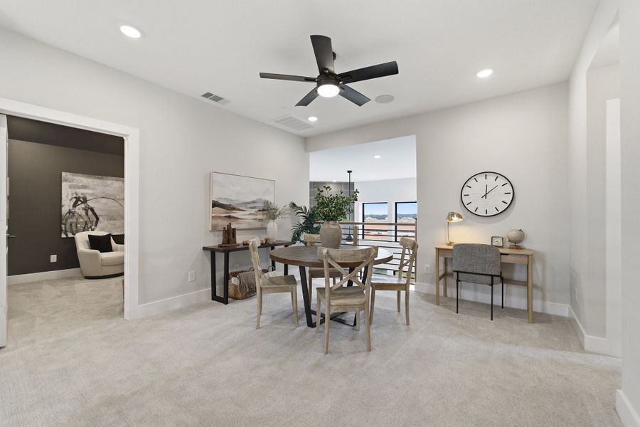 Furnished interior in a model home at Grand Magnolia in Waller (Image 39).