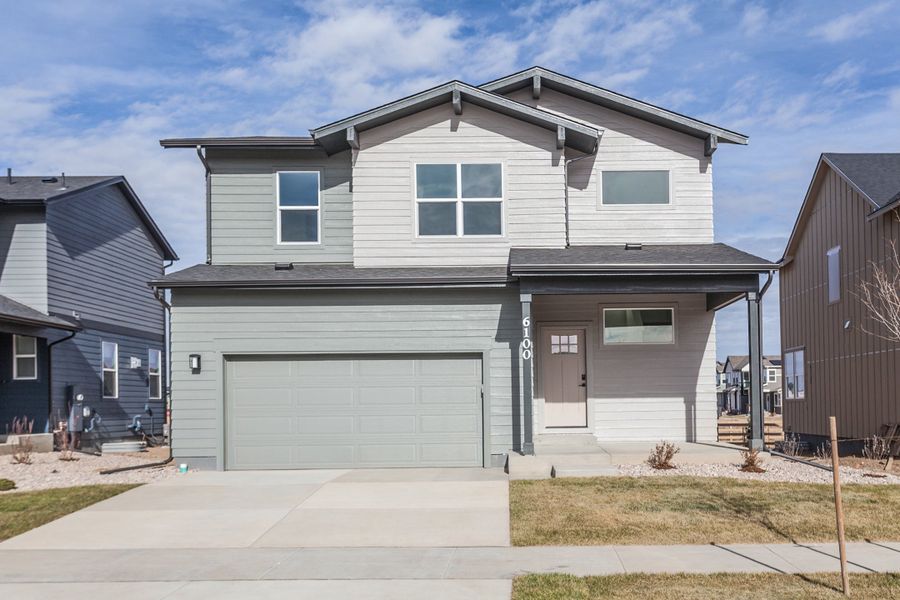 Front exterior of a home in the Trailside Story Collection - Single Family Homes community, located in Timnath, CO (Image 3).