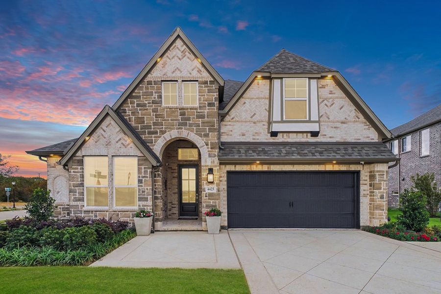 Front exterior of a home in the The Reserve at Spiritas Ranch community, located in Little Elm, TX (Image 3).