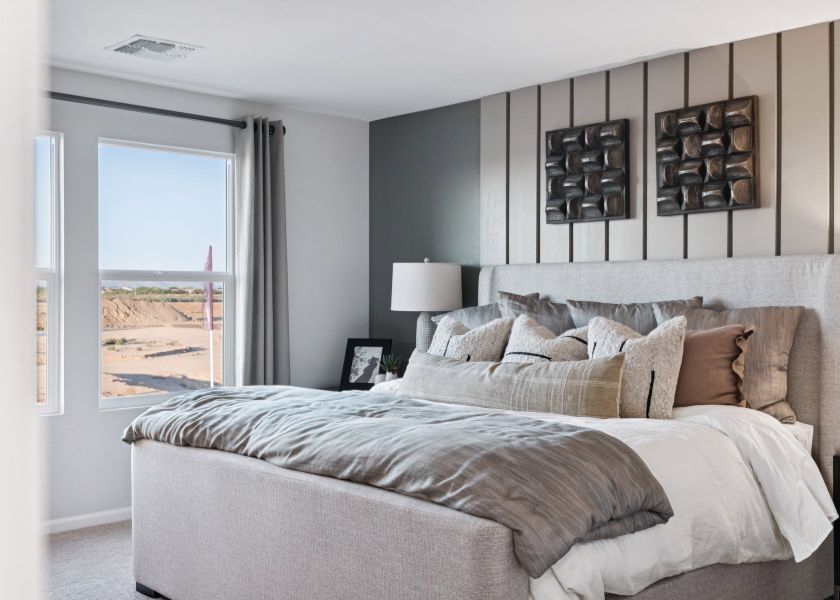 A bedroom with a large bed. A bedroom with a large bed.