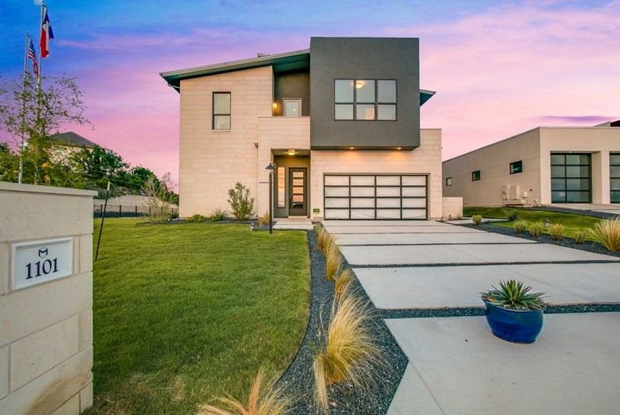 Model home in Lakeway, TX with 3 bedrooms, 2 bathrooms, open concept, gameroom and 2nd & 3rd floor balconies.