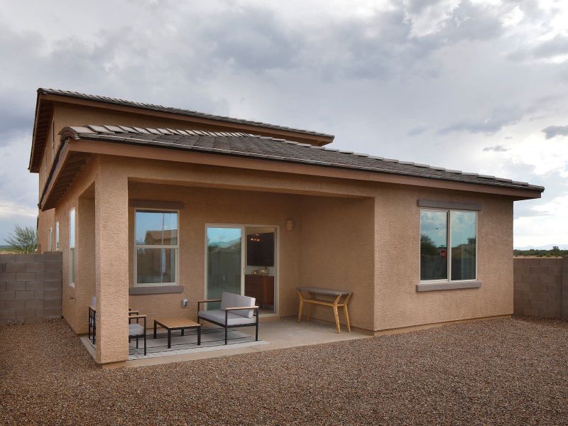 The covered back patio is perfect for afternoon BBQs. The covered back patio is perfect for afternoon BBQs.