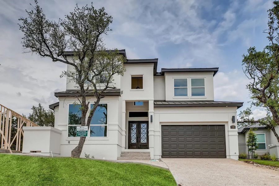 Front exterior of a home in the The Bluff At The Dominion community, located in Shavano Park, TX (Image 7).
