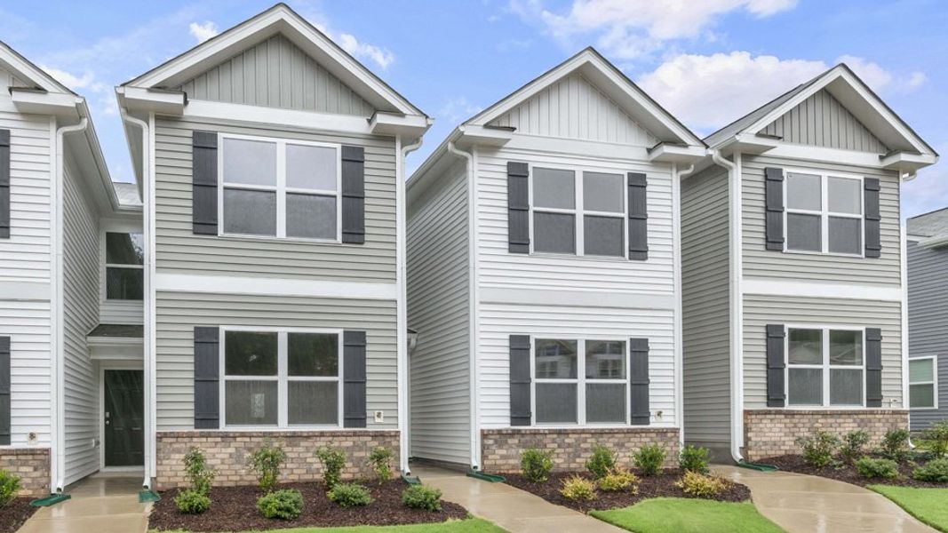 Front exterior of a home in the The Townes at Wilson's Ridge community, located in Wilson's Mills, NC (Image 16).