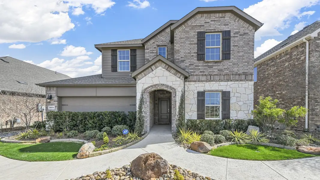 Front exterior of a home in the Silverado community, located in Aubrey, TX (Image 6). Front exterior of a home in the Silverado community, located in Aubrey, TX (Image 6).