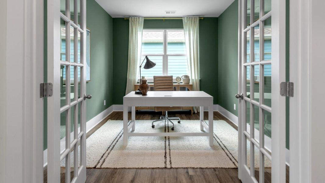 Furnished interior in a model home at The Grove at Blake Farm in Wilmington (Image 7).