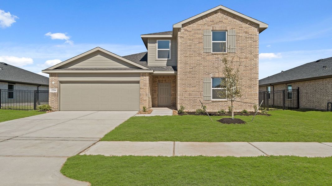 Front exterior of a home in the Sunterra community, located in Katy, TX (Image 14).