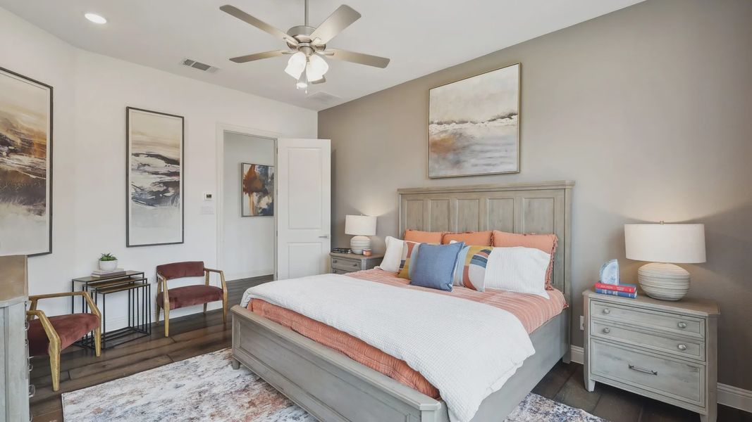 Elegant bedroom with plush textiles, abstract art, and sophisticated lighting in Heritage Park.