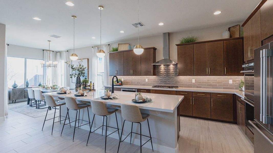 Exquisite kitchen in Arroyo Seco boasts a spacious island, dark wood cabinets, and elegant pendant lighting. Exquisite kitchen in Arroyo Seco boasts a spacious island, dark wood cabinets, and elegant pendant lighting.