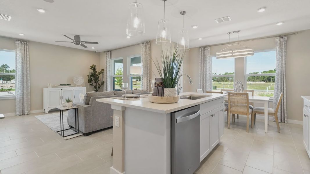 Cyrene at Harmony by DRB Homes offers an open-concept kitchen and living room—ideal for gathering with family and friends. Cyrene at Harmony by DRB Homes offers an open-concept kitchen and living room—ideal for gathering with family and friends.