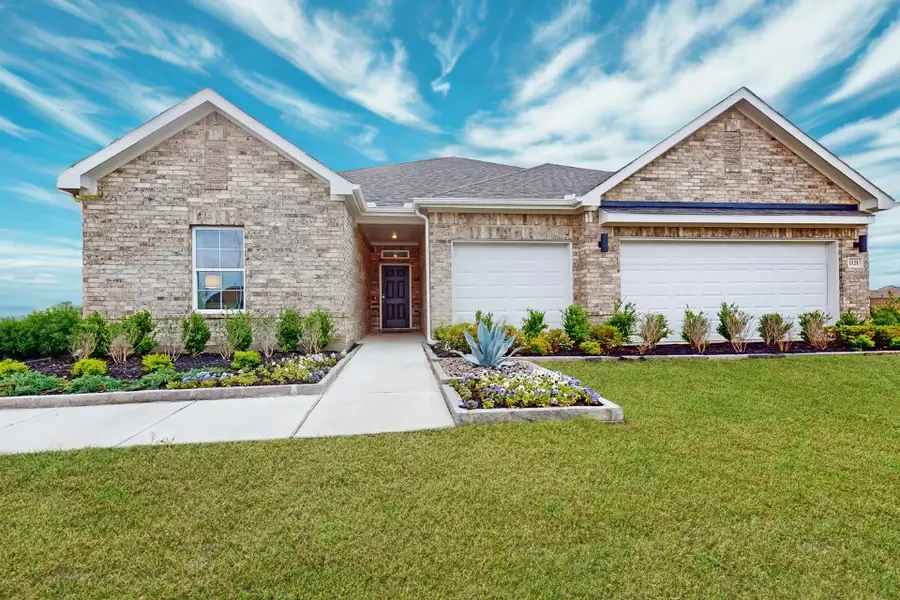 A house with a large front yard.