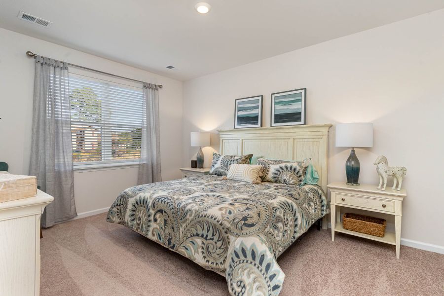 Furnished interior in a model home at Island Green in Myrtle Beach (Image 61).