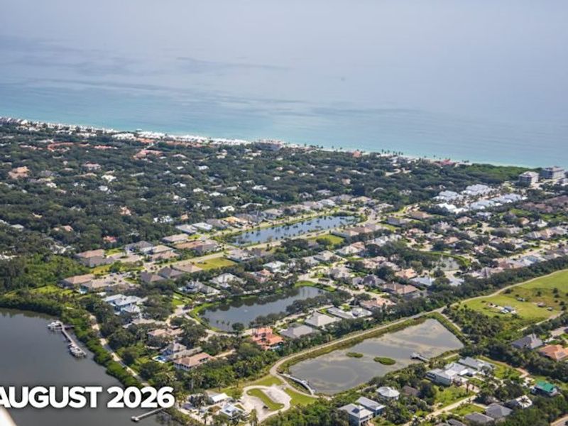 Aerial view of the The Strand community in Vero Beach, FL, showing layout and nearby surroundings (Image 7).