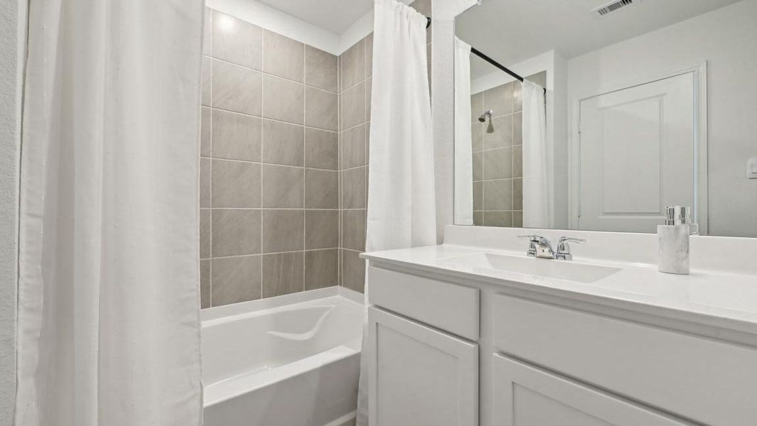 Furnished interior in a model home at The Villas at Legacy Park in Houston (Image 16).