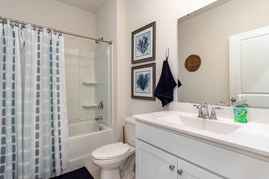 Furnished interior in a model home at Island Green in Myrtle Beach (Image 48).