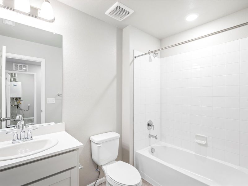 Bathroom in the Woodland floorplan at a Meritage Homes community in Broomfield, CO.