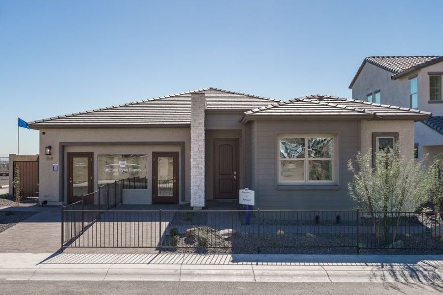 Front exterior of a home in the The Ridge at Sienna Hills community, located in Buckeye, AZ (Image 4).