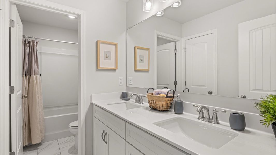 Furnished interior in a model home at Thalley Creek Estates in Cumming (Image 27).