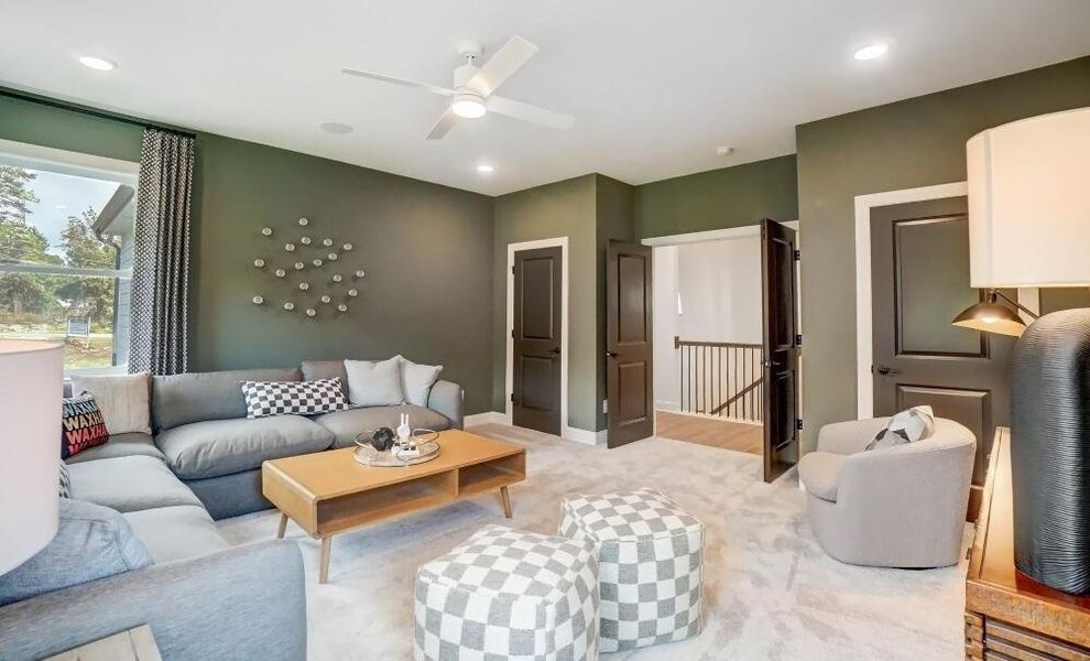 Furnished interior in a model home at Peyton's Creek in Statesville (Image 13).