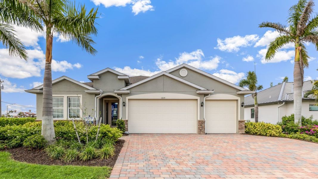 Front exterior of a home in the Cape Coral Signature community, located in Cape Coral, FL (Image 2).
