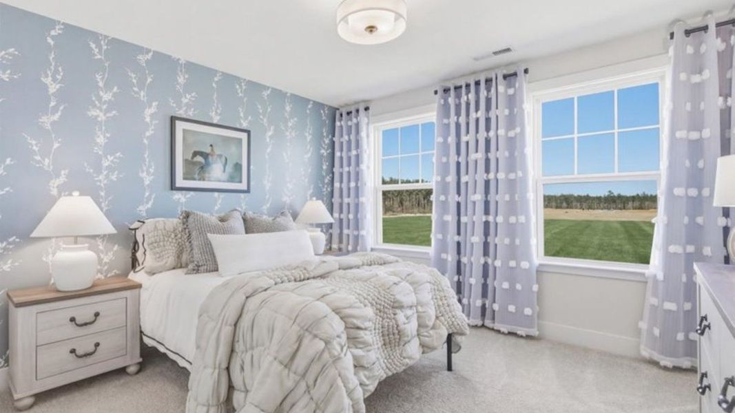 Furnished interior in a model home at Weavers Pointe in Zebulon (Image 24).
